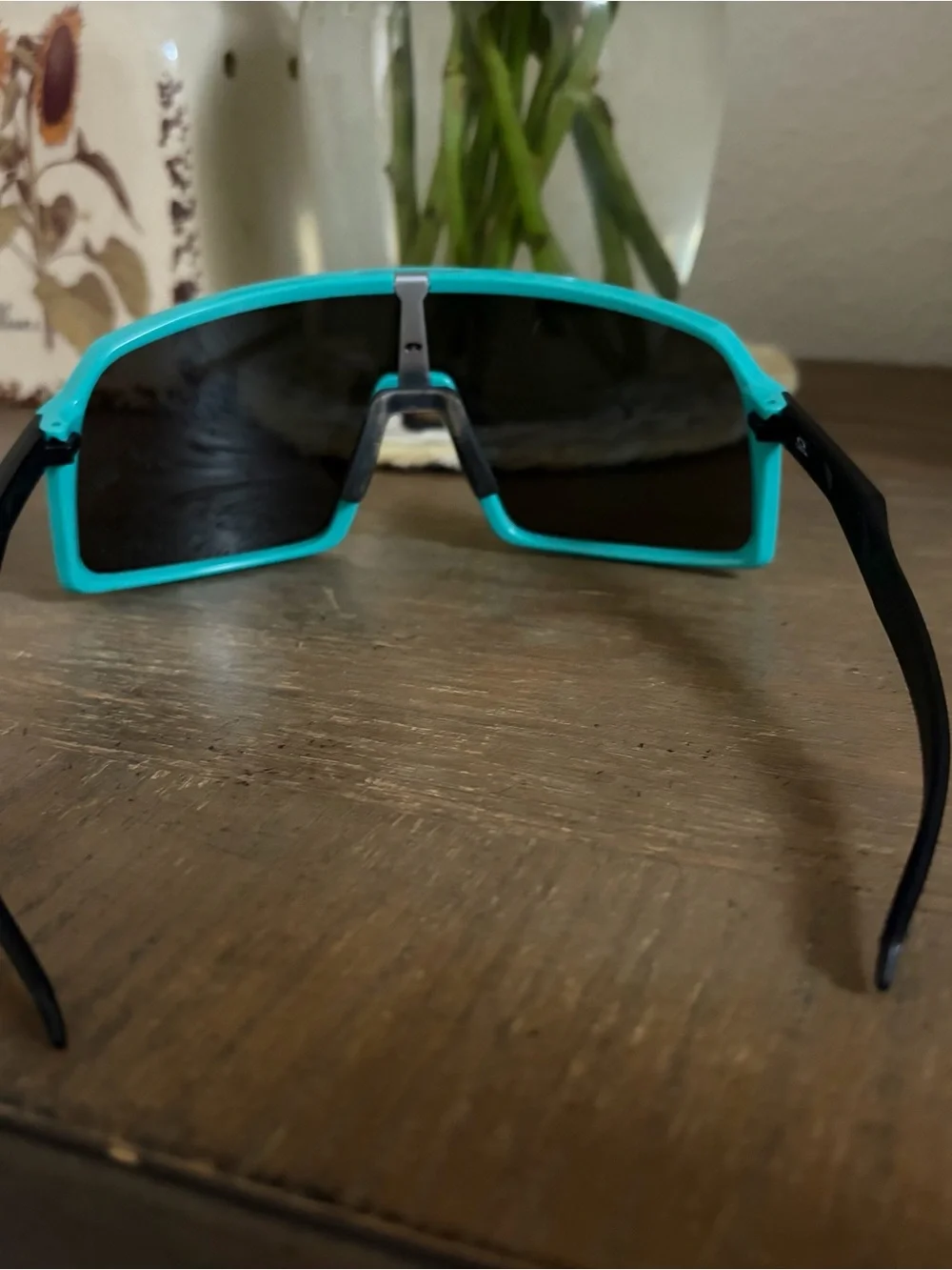 Woman teal Oakley sunglasses